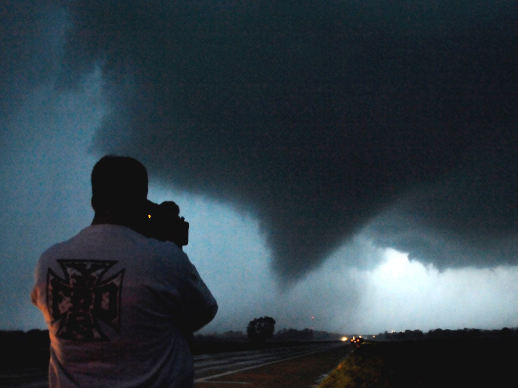 A tornado makes its way over the 135 freeway near Moundridge, Kansas, during the third day of severe weather and multiple tornado sightings