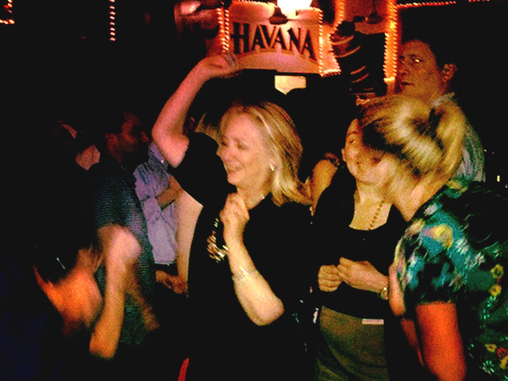 US Secretary of State Hillary Clinton enjoys a relax moment at Cafe Havana in Cartagena, Colombia