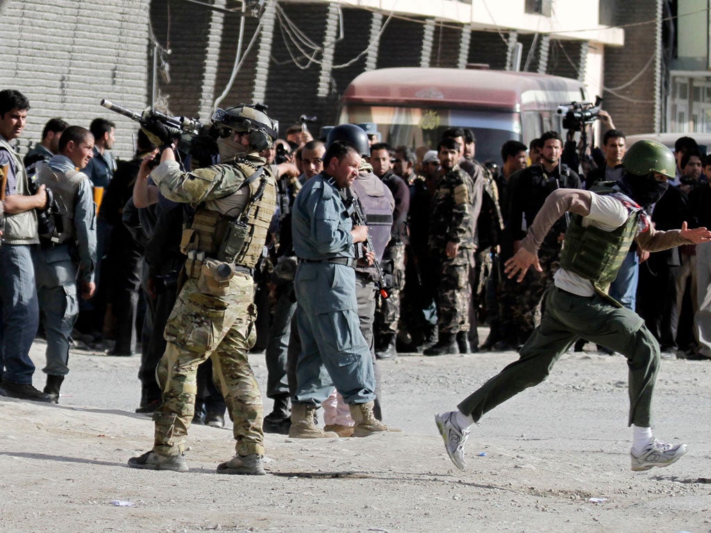A Nato soldier at the scene of an attack by militants
in Kabul yesterday
