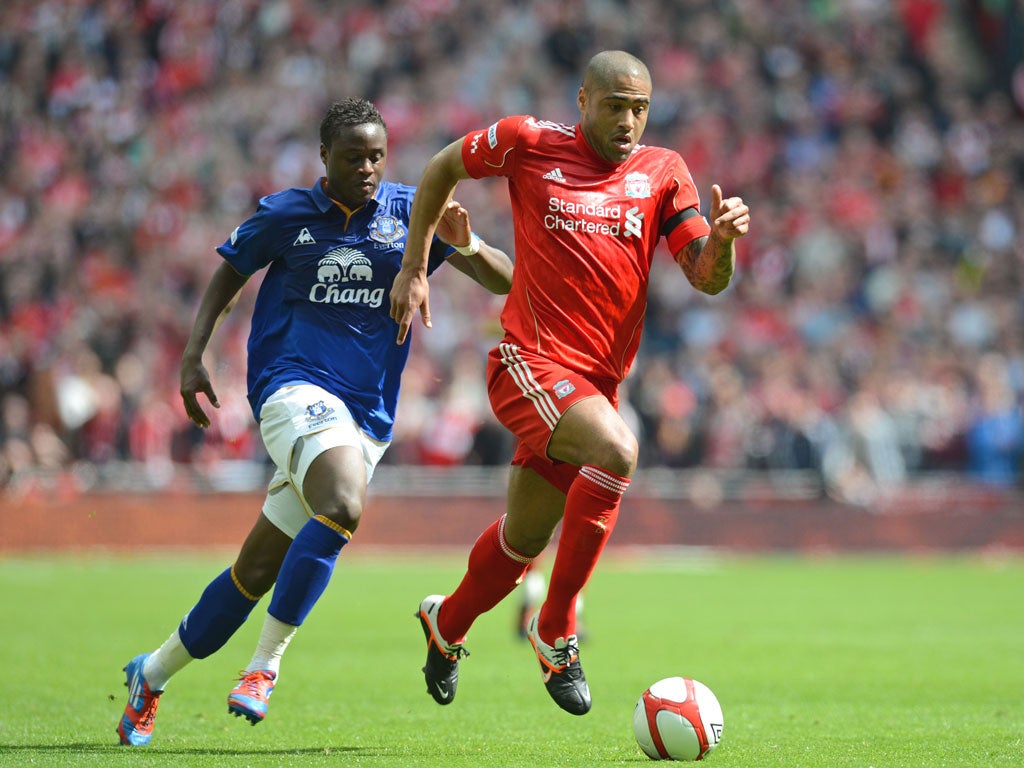 Glen Johnson shows Everton’s Magaye Gueye a clean pair of heels during Liverpool’s semi-final win