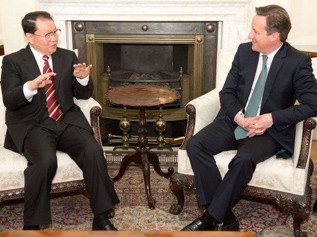 David Cameron (right) meets Chinese Communist Party official Li Changchun today