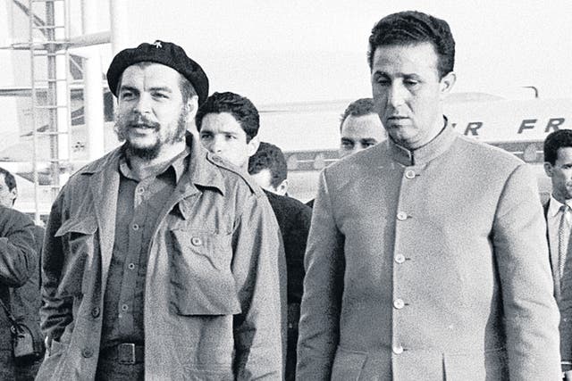 Comrades: Ben Bella, right, with Che Guevara at Algiers airport in 1964
