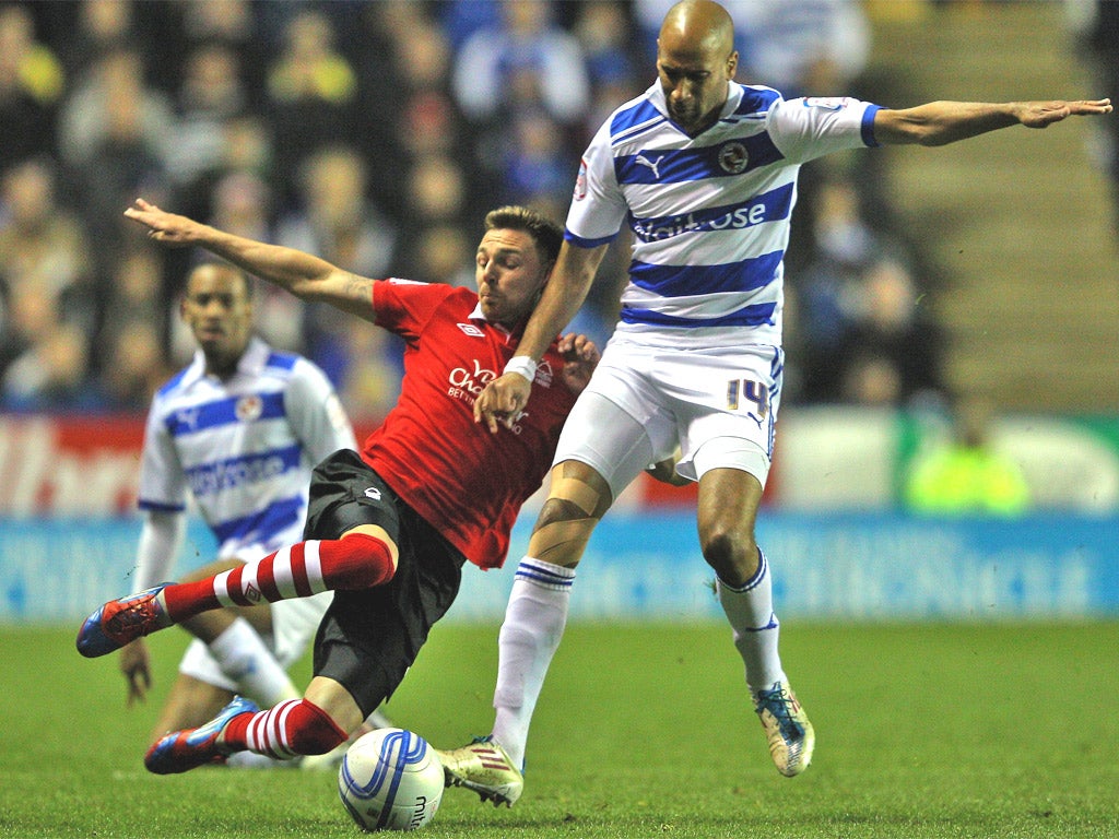 Nottingham Forest's Paul Anderson tackles Jimmy Kebe of Reading