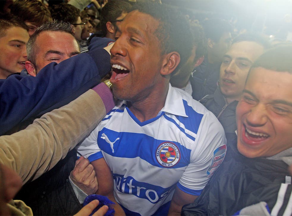 Mikele Leigertwood is mobbed by jubilant Reading fans