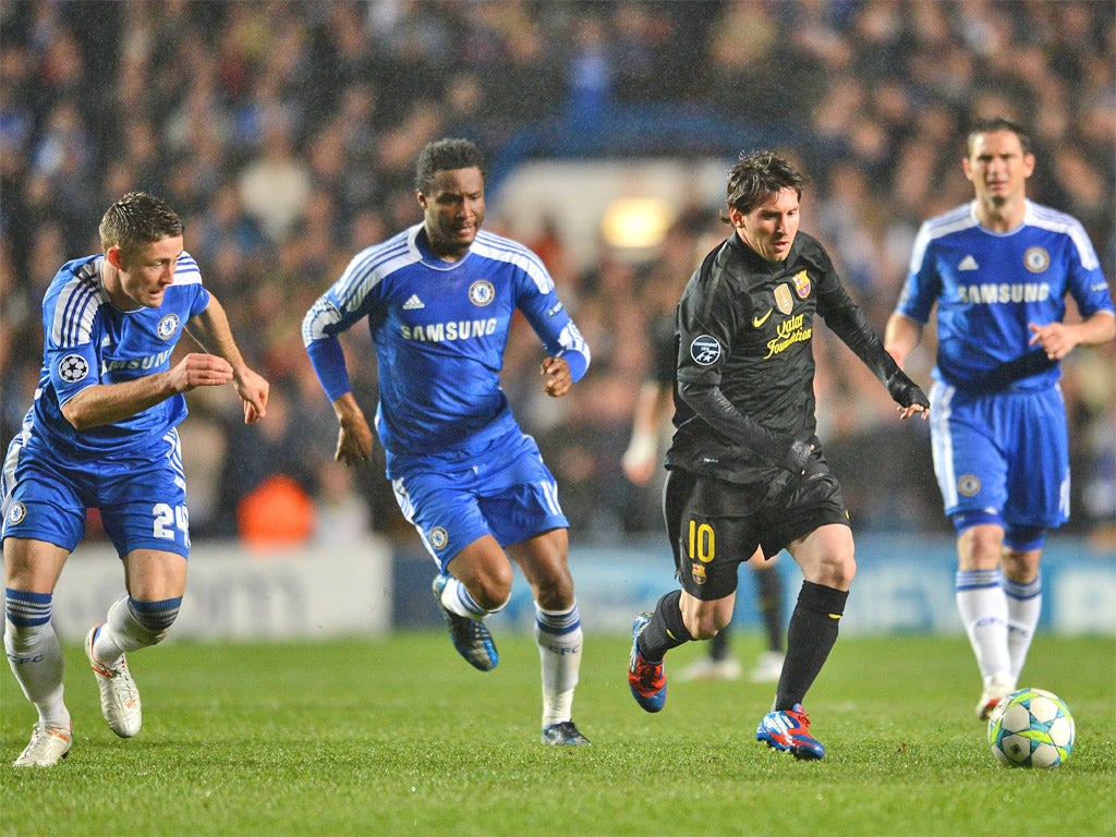 Leo Messi takes on a packed Chelsea defence