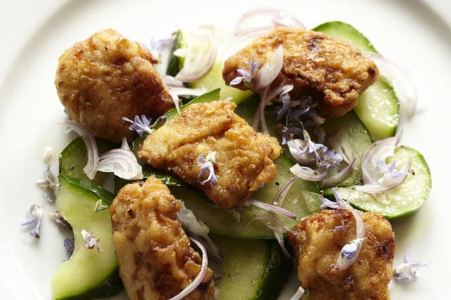 Crispy sea bass with rosemary flowers and cucumbers