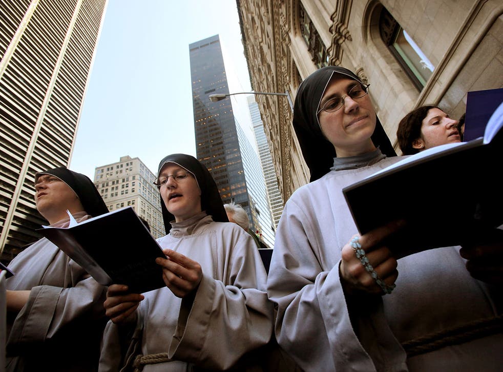 American nuns say prayers next to the World Trade Center site in New York