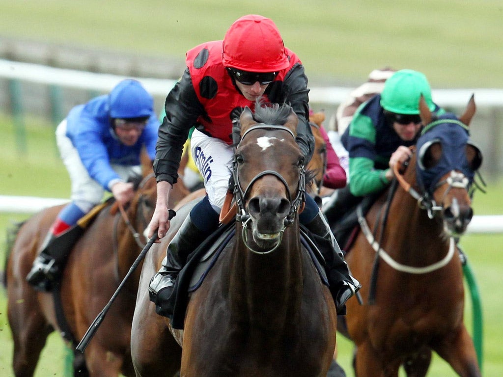 Ryan Moore pushes Trumpet Major out to go clear in the Craven Stakes