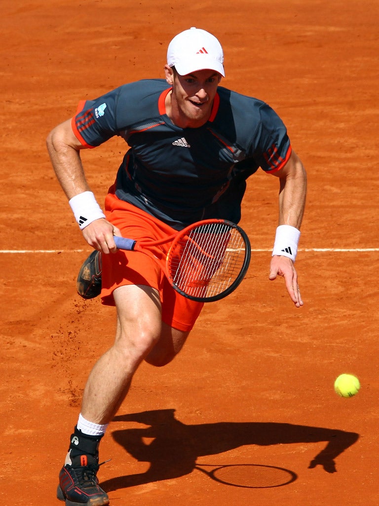AndyMurray chases down a return yesterday in a match that was ended at 6-5 after Julien Bonneteau fell and broke an elbow bone