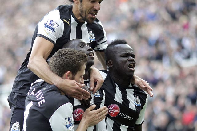 Cheick Tiote celebrating with his Newcastle team-mates