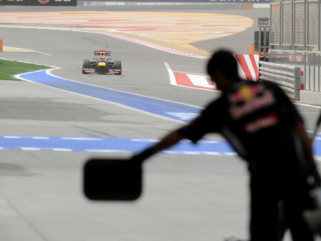 Red Bull Racing's German driver Sebastian Vettel arrives in the pits in Bahrain