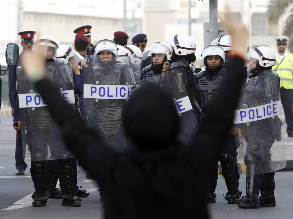 A protester flashes a victory sign during an anti-government rally in Bahrain