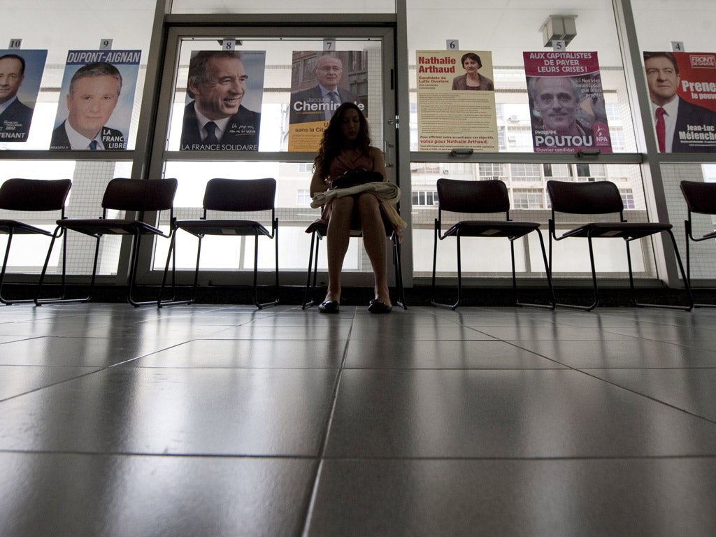 A French citizen waits to cast her vote in the French consulate in Rio de Janeiro