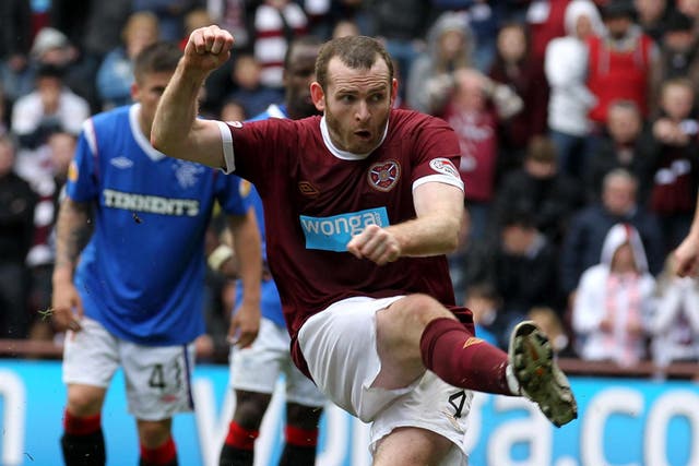 Penalty paid: Craig Beattie misses from
the spot as Hearts lose to Rangers
