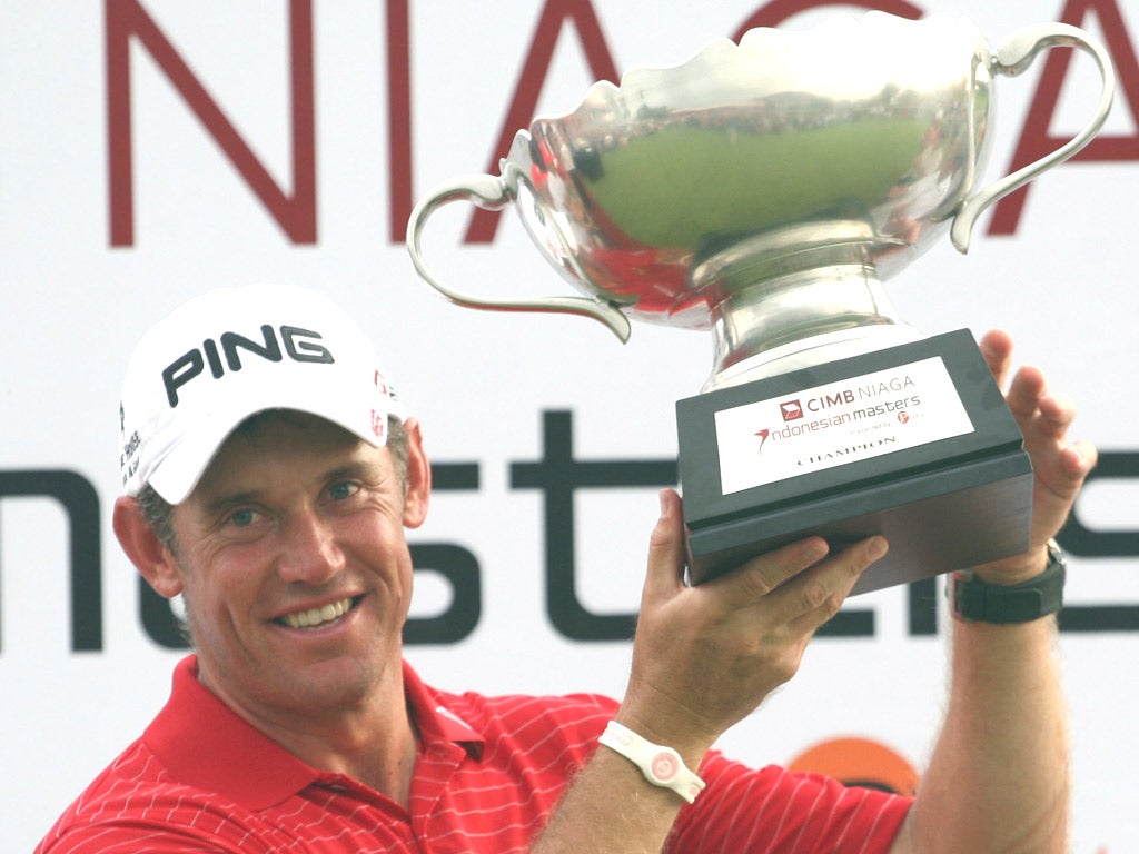 Lee Westwood is delighted to raise the Indonesian Masters trophy