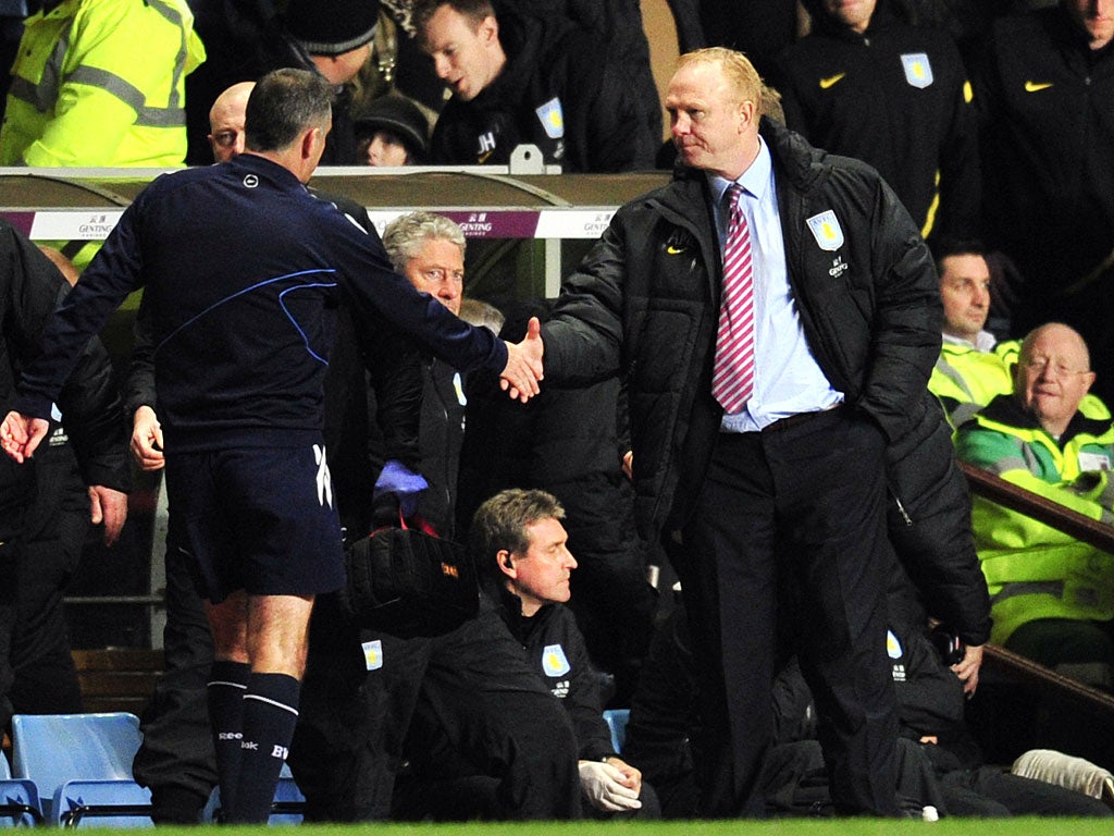 Alex McLeish shakes hands with Bolton manager Owen Coyle
