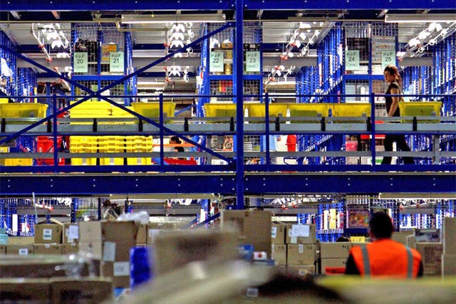 Take your pick: Amazon staff in a typical distribution centre in Milton Keynes. The US firm is now moving into the industrial-supply business