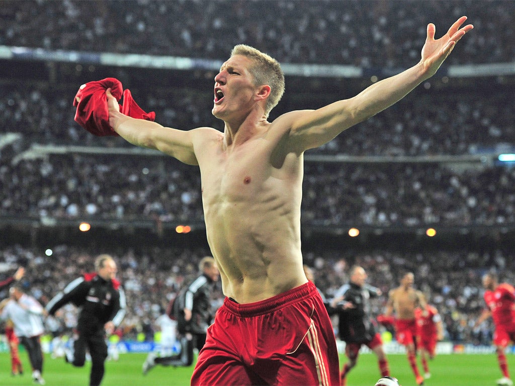 Bastian Schweinsteiger of Bayern Munich celebrates scoring the winning penalty