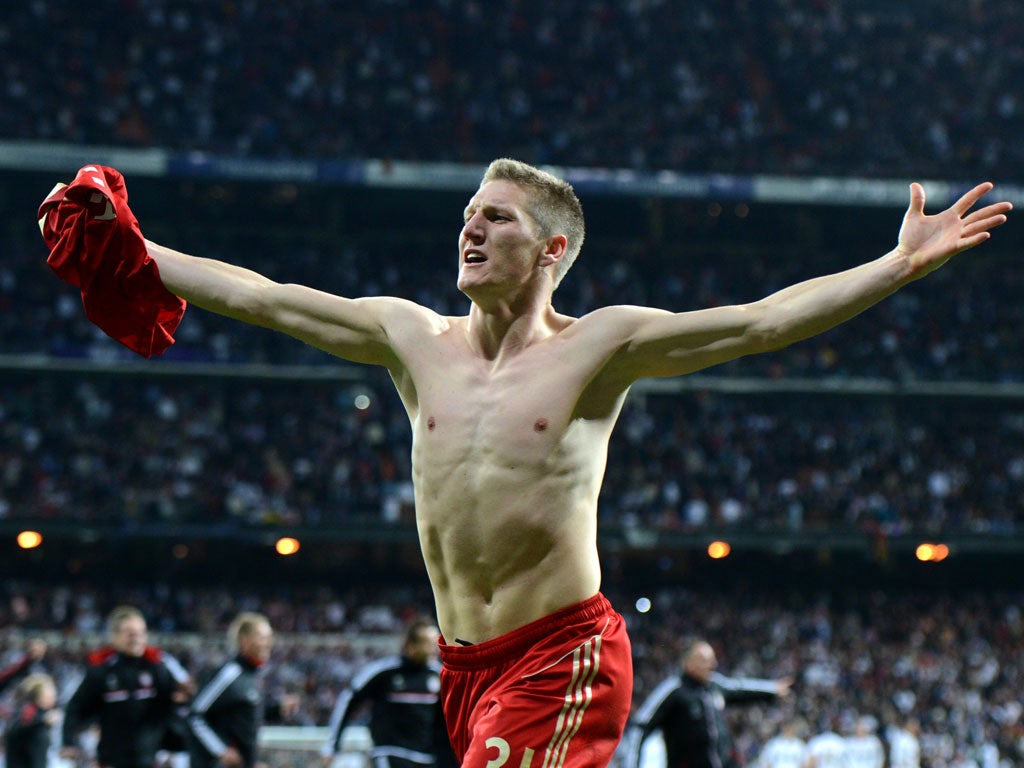 Bayern Munich's midfielder Bastian Schweinsteiger celebrates after scoring the winning penalty