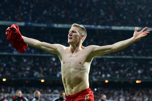 Bayern Munich's midfielder Bastian Schweinsteiger celebrates after scoring the winning penalty 