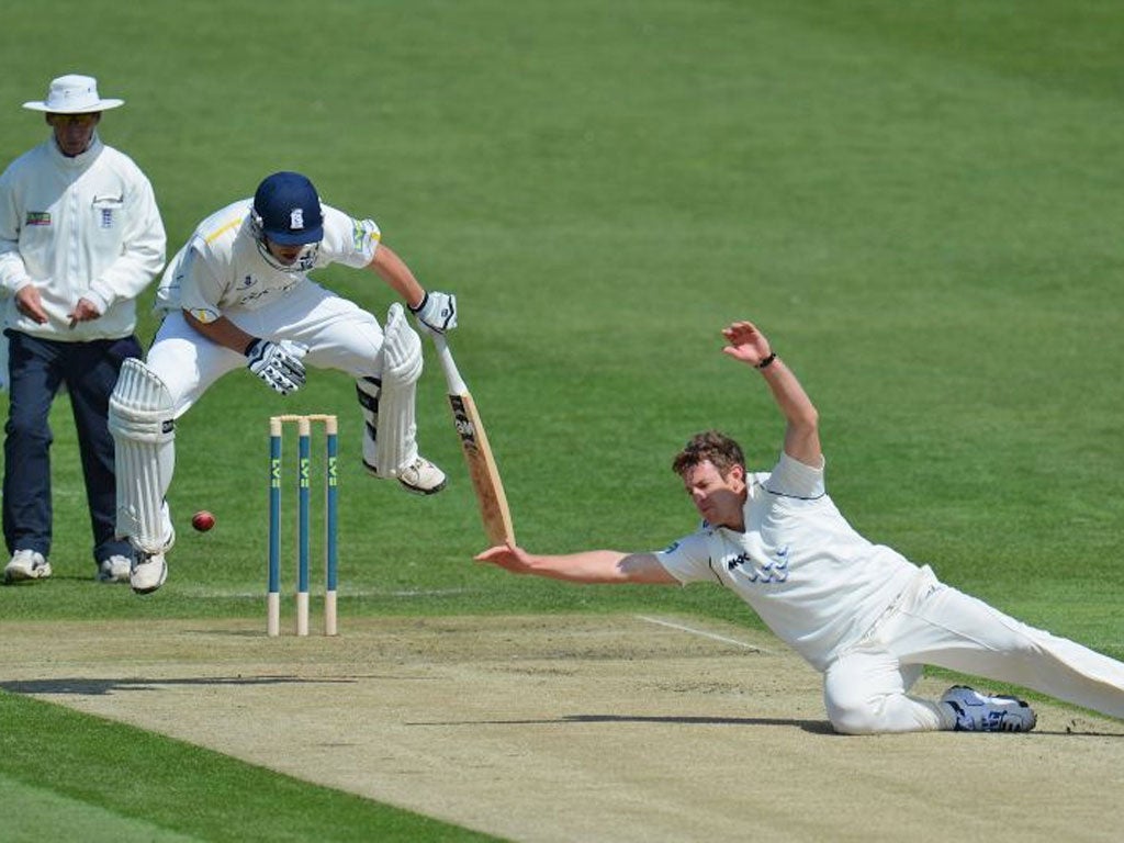 Jonathan Trott takes evasive action during a century at Hove