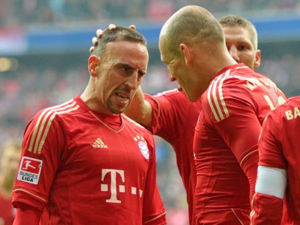Franck Ribéry (left) and Arjen Robben (right) celebrate a goal for Bayern Munich this season.
Bayern may be the biggest club in Germany but five
clubs have been champions in the last nine years