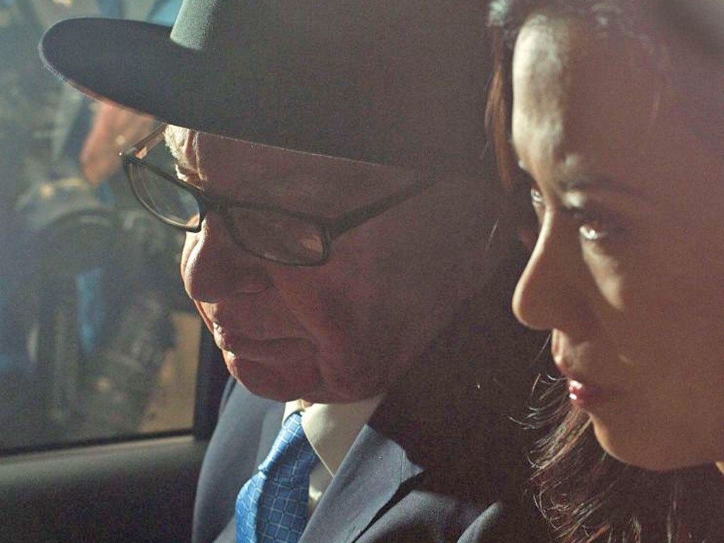 Rupert Murdoch and Wendi Deng leave the High Court in London after his final day of evidence at the Leveson Inquiry