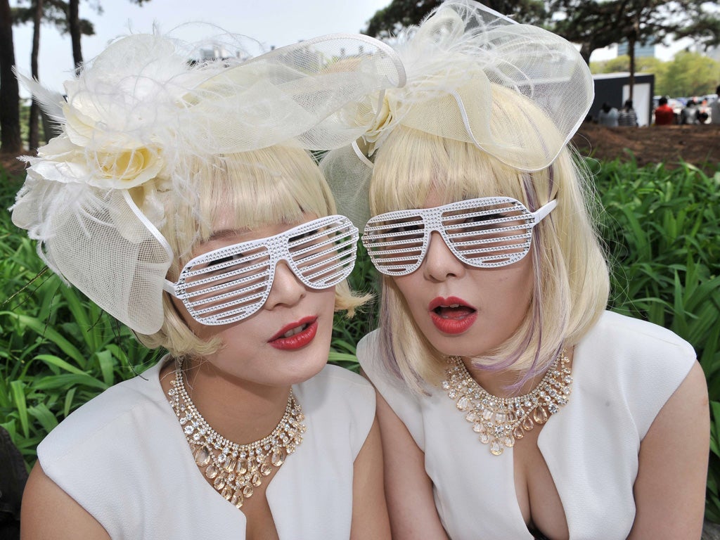 Lady Gaga fans known as 'Little Monsters' in Korea wait outside the Seoul's Olympic Stadium for the star's concert