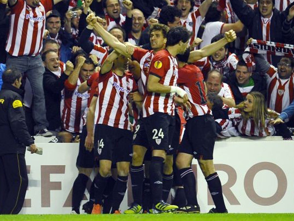 Fernando Llorente is mobbed by his Athletic team-mates on Thursday night