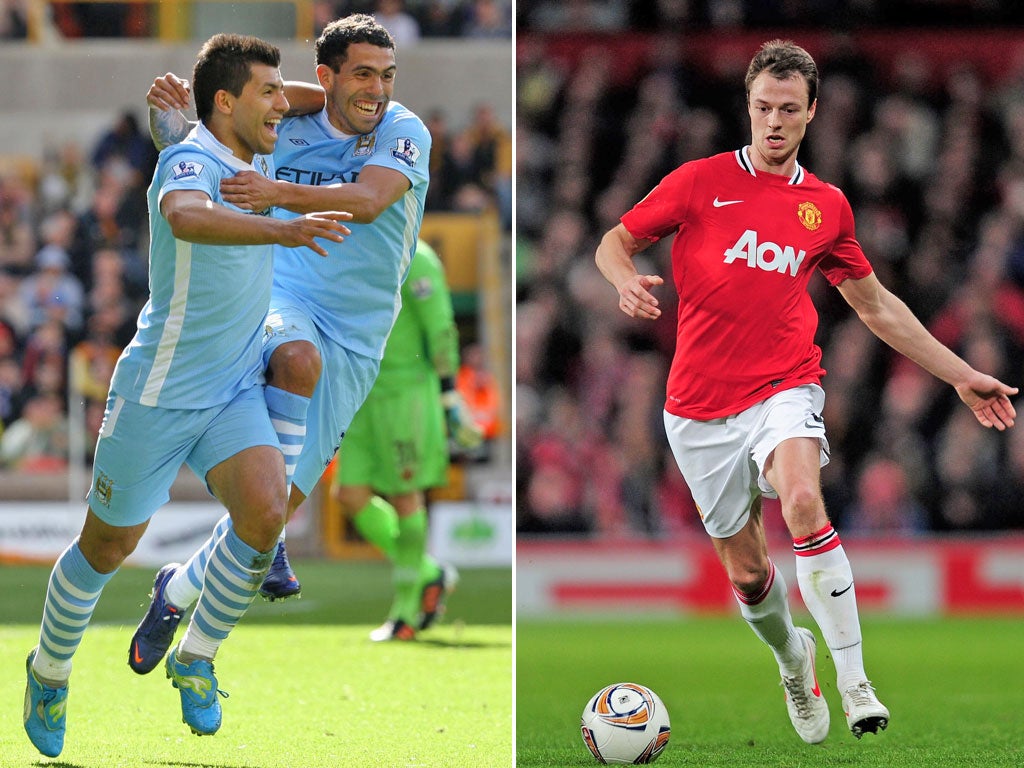 Facing Carlos Tevez and Sergio Aguero (left) will test the mettle of Jonny Evans (right)