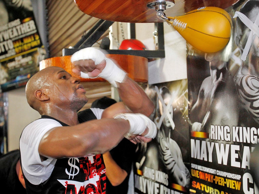 Rolling with the punches: Floyd Mayweather Jnr is resigned to a prison stint after he fights Miguel Cotto next Saturday
