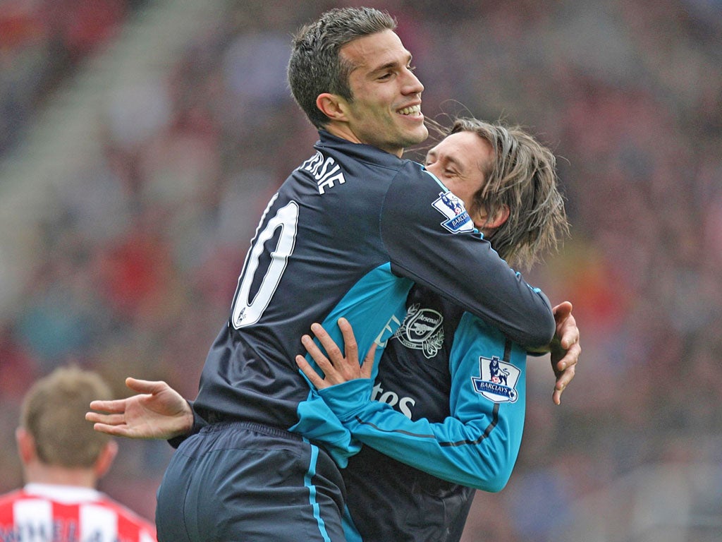 Arsenal's Robin van Persie celebrates scoring their first goal of the game with team-mate Tomas Rosicky