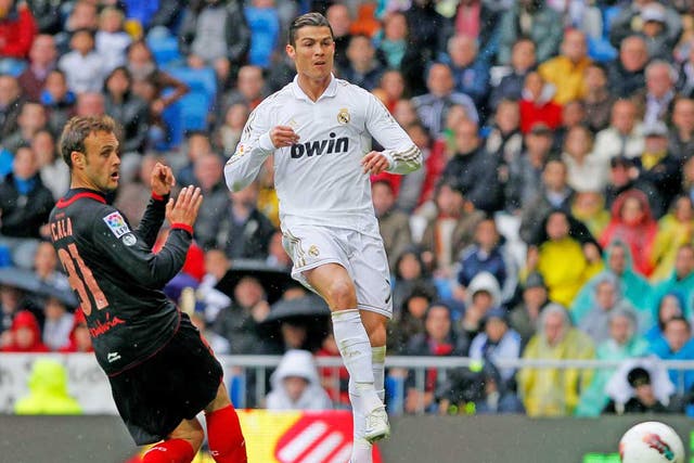 Cristiano Ronaldo scores his 43rd league goal of the season in Real Madrid’s 3-0 win over Sevilla