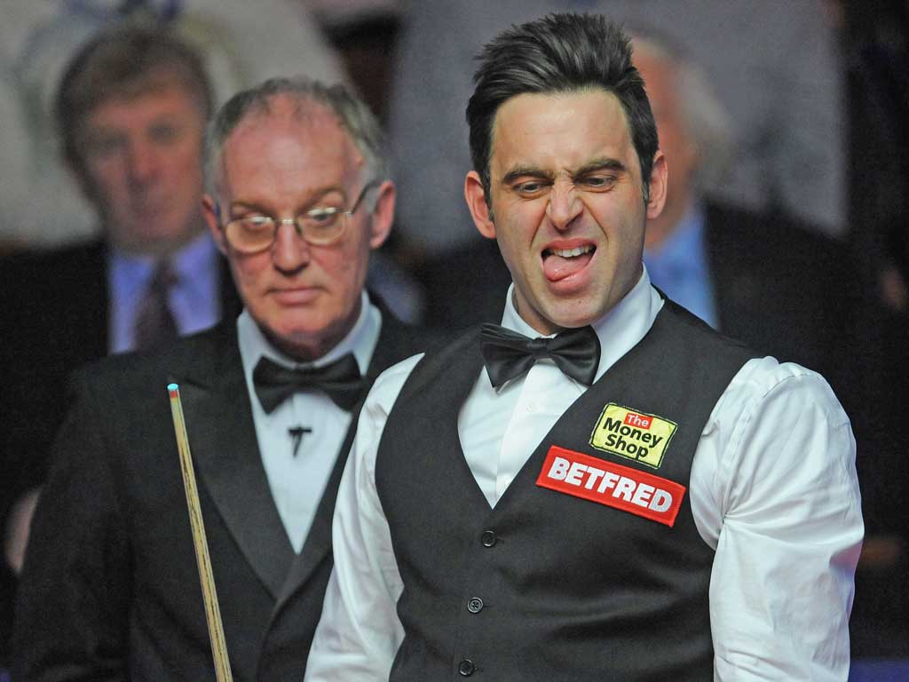 Ronnie O’Sullivan reacts to a shot during his match
against Mark Williams at the Crucible