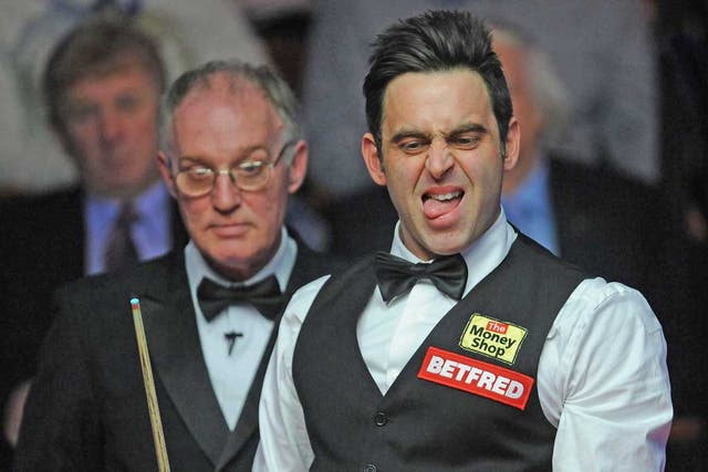 Ronnie O’Sullivan reacts to a shot during his match
against Mark Williams at the Crucible