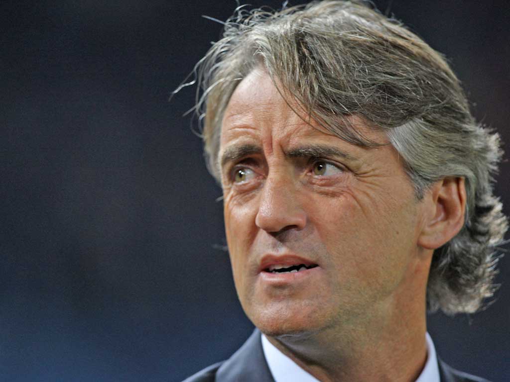 Roberto Mancini stands on the threshold of dethroning the defending champions