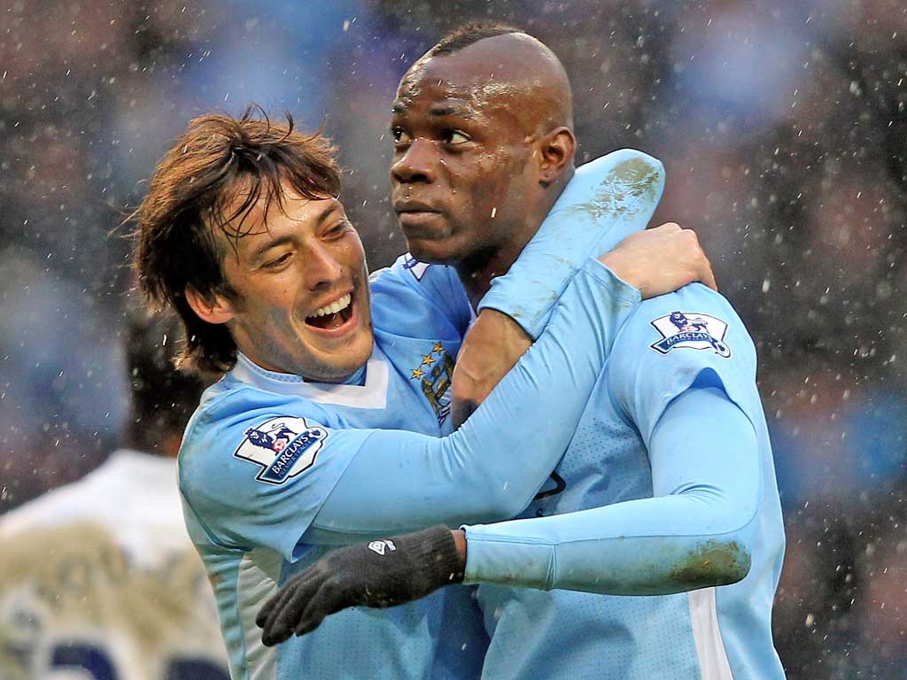Manchester City spent £21m on Mario Balotelli (right), £24m on David Silva and much more besides in an effort to break in to the elite