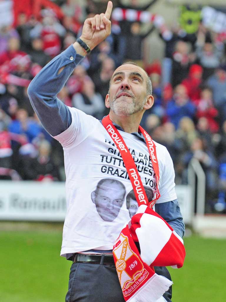 Swindon’s Paolo Di Canio wears a T-shirt paying tribute to his late parents after winning League Two