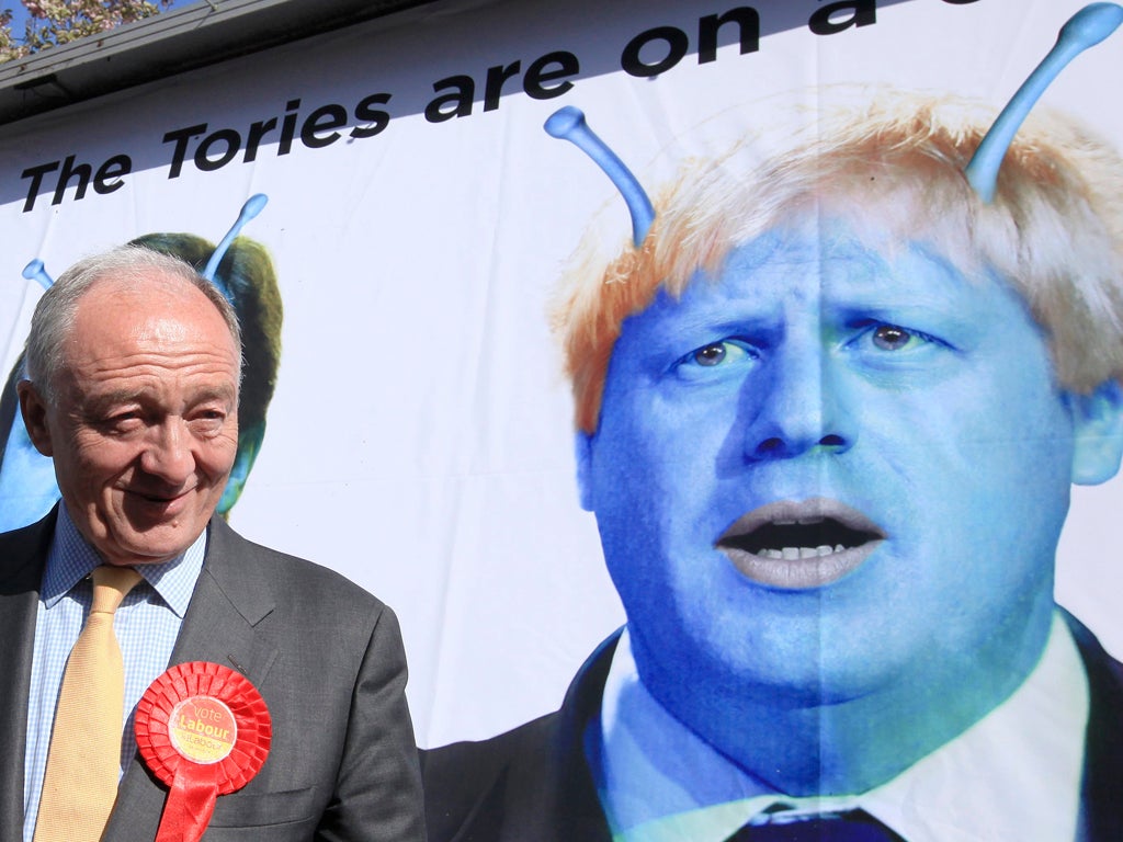 Britain's Labour candidate for London Mayor, Ken Livingstone stands in front of a poster depicting London Mayor Boris Johnson as an alien, to launch Labour's new Ad Bus in south London on April 30, 2012