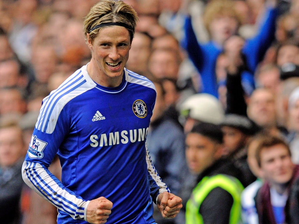 Fernando Torres celebrates his third goal in the 6-1 win over QPR