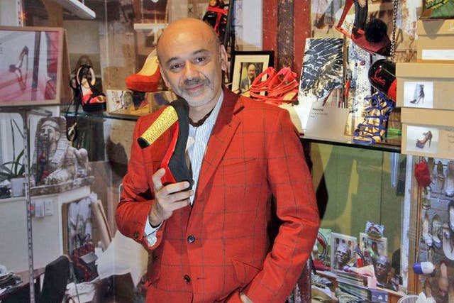 French shoe designer Christian Louboutin attends a preview of an exhibition celebrating 20 years of Christian Louboutin designs at the Design Museum