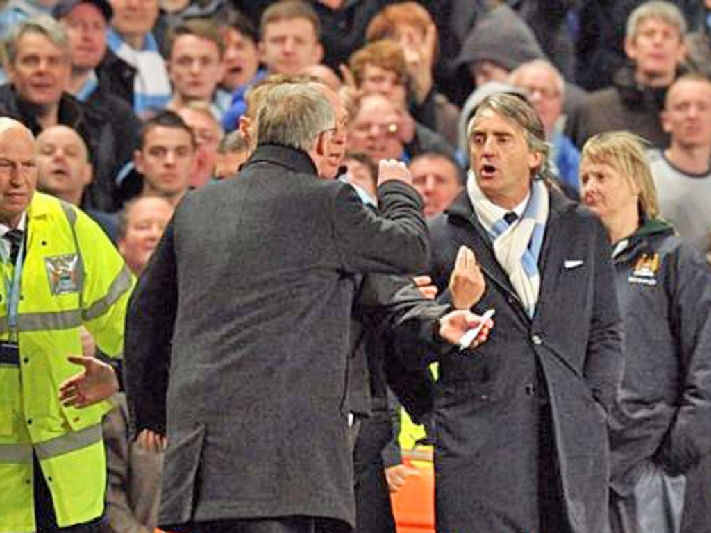 Sir Alex Ferguson and Roberto Mancini had to be kept apart on the touchline last night
