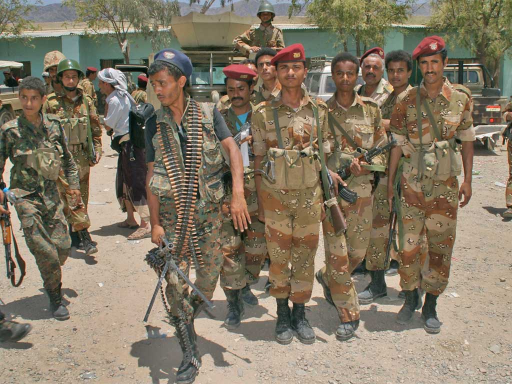 Yemeni army soldiers gather at their military base in the southern town of Loder, in Abiyan province, where they fight against Al-Qa'ida militants