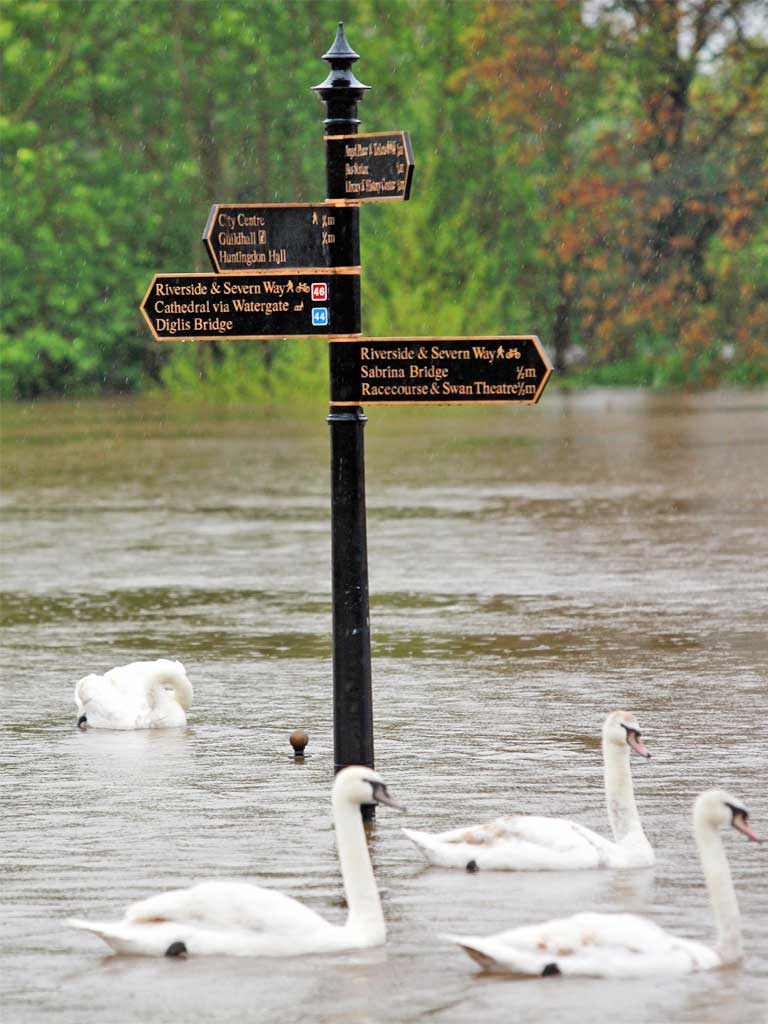 Signs showing walks along the River Severn in Worcester. Nearly 30mm (1.2in) of rain fell in 12 hours in some areas of the UK yesterday