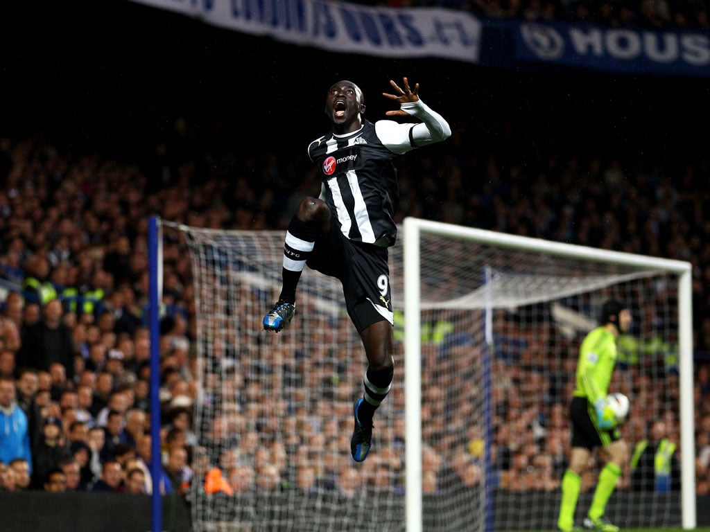 Papiss Cisse of Newcastle celebrates after scoring the opening goal during the Barclays Premier League match against Chelsea