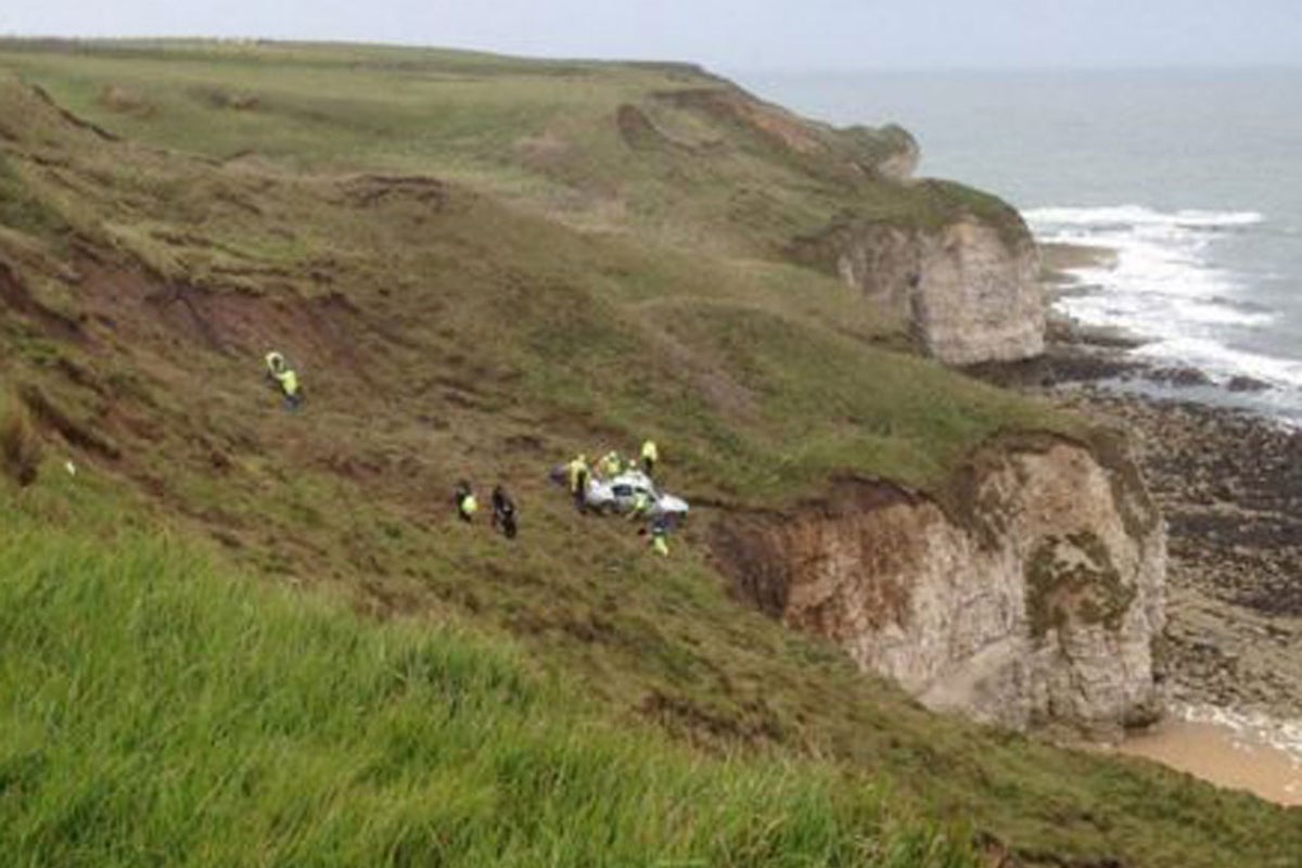 Woman rescued after car stops 'precariously close' to cliff edge | The ...