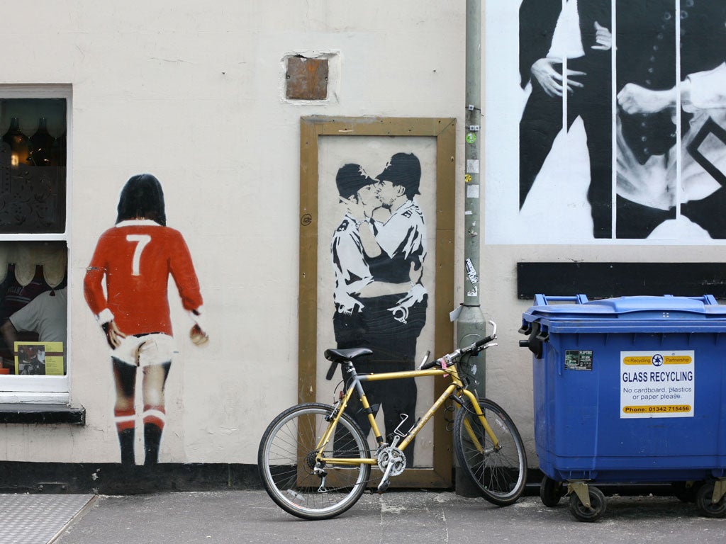 Kissing policemen by Banksy