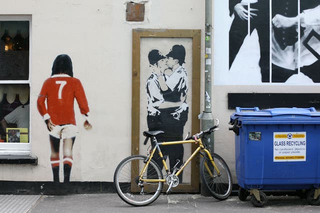 Kissing policemen by Banksy