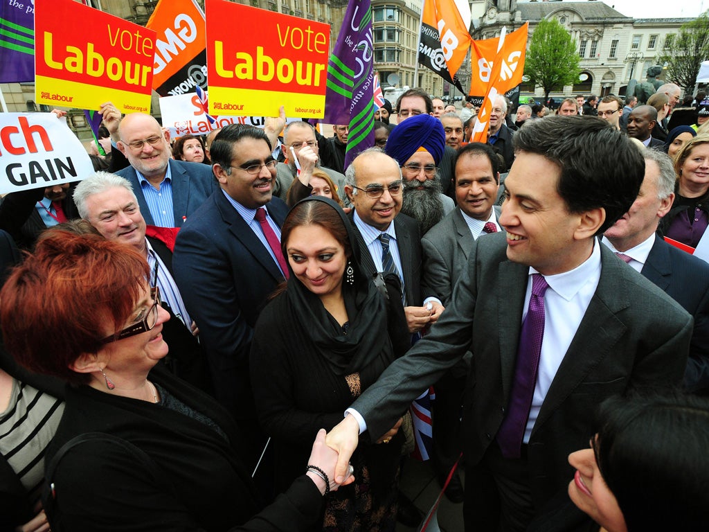 Labour leader Ed Miliband greets supporters in Birmingham – but was hit by an egg in Southampton