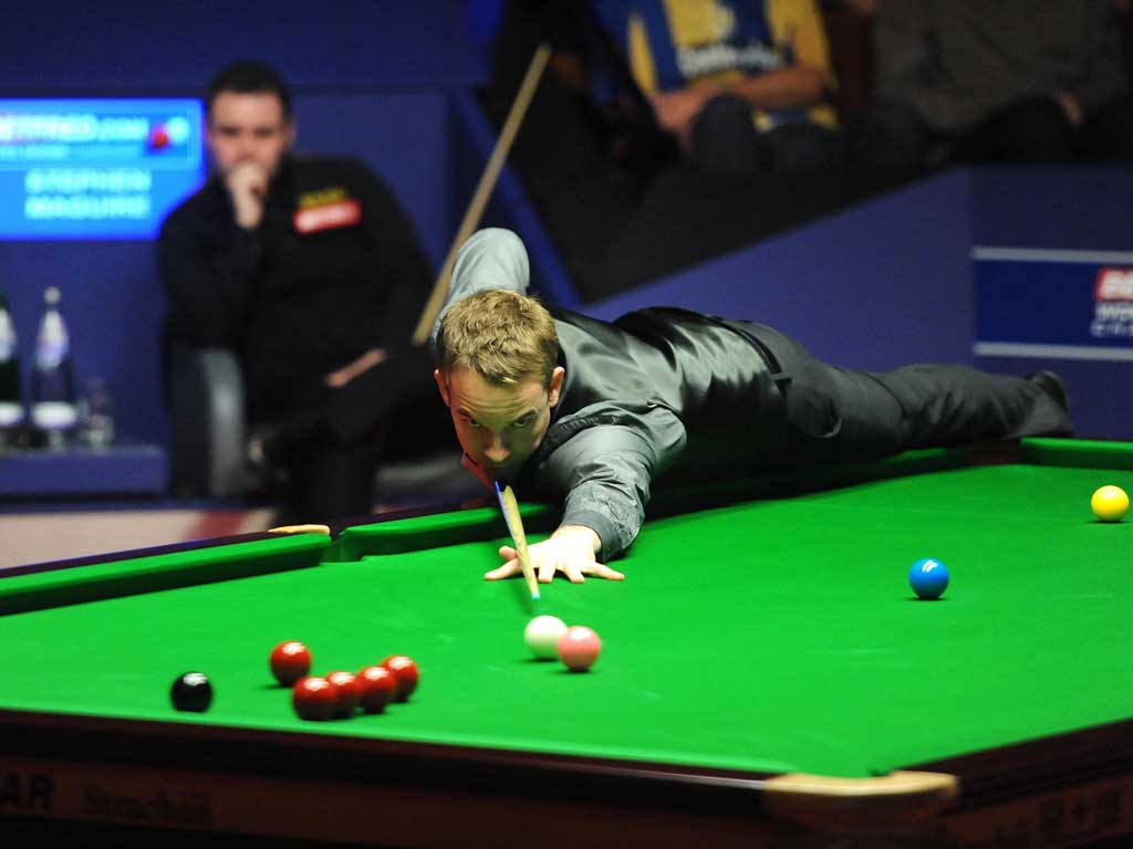 Heat is on: Ali Carter on his way to beating Stephen Maguire at the Crucible